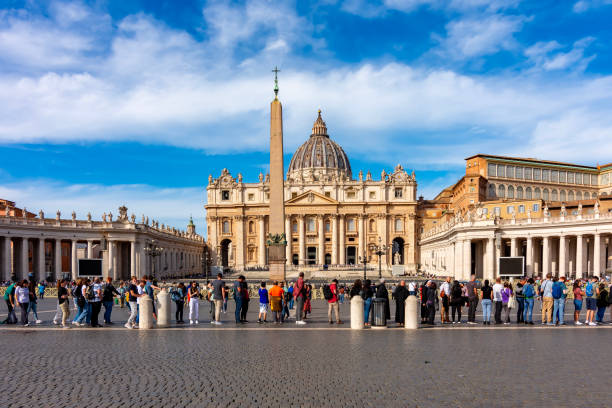 people standing in line to visit st peters basilica on st peters square in vatican center