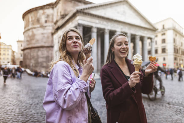 tourist women eating ice cream in rome