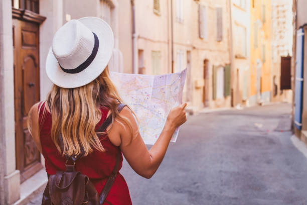 travel to europe tourist looking at map on the street summer holidays